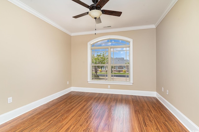 7041 Turtle Cove Dr, Myrtle Beach, SC 29579 - spare room featuring baseboards, wood finished floors, ornamental molding, and a ceiling fan