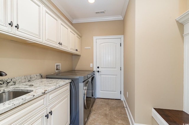 7041 Turtle Cove Dr, Myrtle Beach, SC 29579 - laundry area featuring cabinet space, ornamental molding, washing machine and clothes dryer, light tile patterned floors, and baseboards