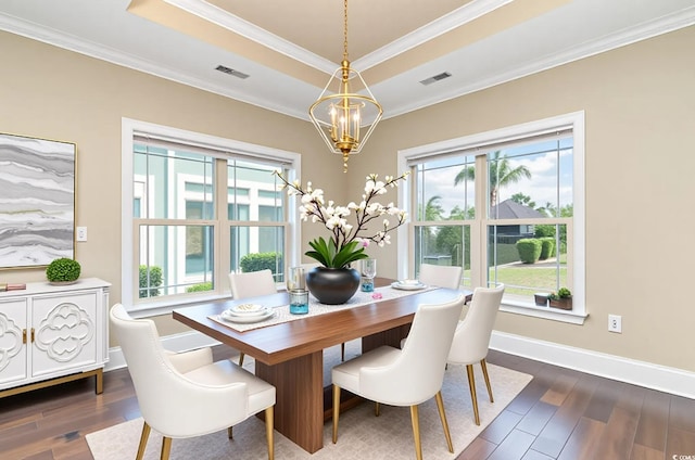 7041 Turtle Cove Dr, Myrtle Beach, SC 29579 - dining room with a chandelier, a raised ceiling, dark wood finished floors, crown molding, and baseboards