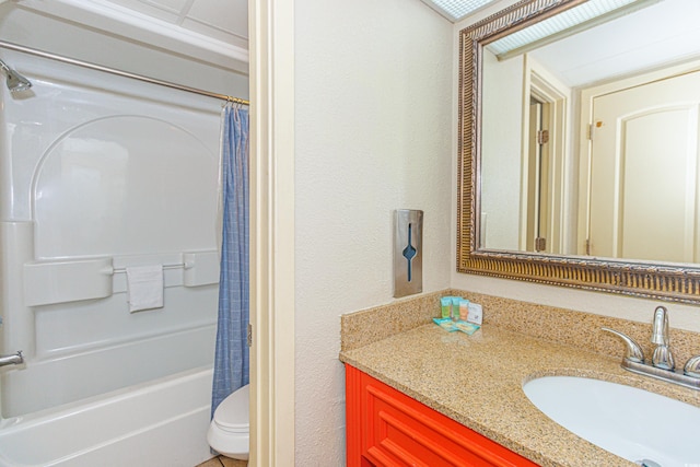 full bath with vanity, toilet, shower / bath combo with shower curtain, and a textured wall