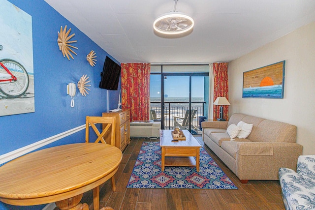 living area featuring wood finished floors and expansive windows
