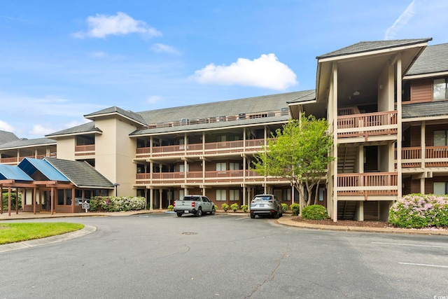 view of property featuring uncovered parking