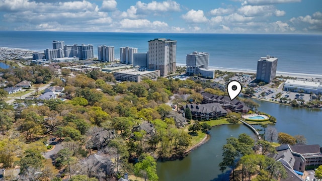 view of urban area featuring a large body of water