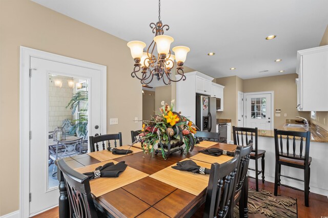 2213 Gazebo Ct, North Myrtle Beach, SC 29582 - dining area featuring a chandelier, wood finished floors, and recessed lighting