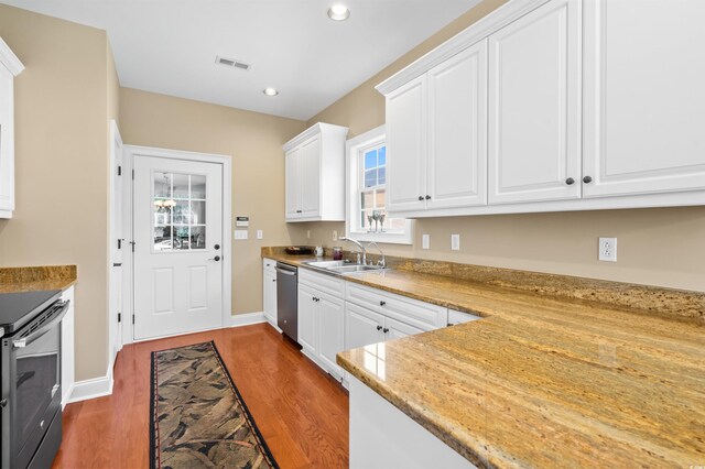 2213 Gazebo Ct, North Myrtle Beach, SC 29582 - kitchen with a sink, appliances with stainless steel finishes, dark wood-type flooring, white cabinets, and recessed lighting
