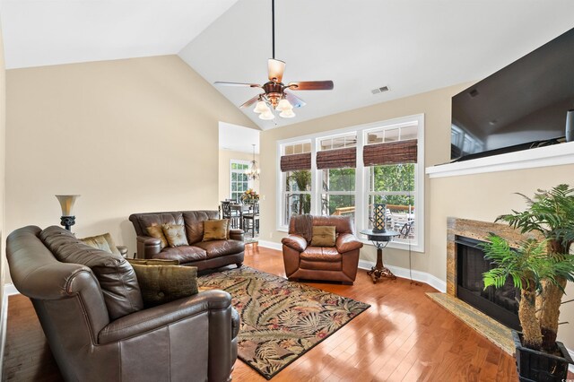 2213 Gazebo Ct, North Myrtle Beach, SC 29582 - living area with ceiling fan, wood finished floors, a fireplace, high vaulted ceiling, and baseboards