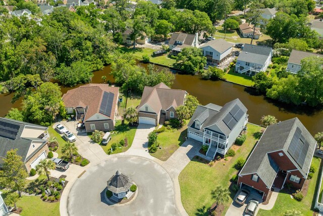 2213 Gazebo Ct, North Myrtle Beach, SC 29582 - aerial perspective of suburban area featuring a large body of water and a tree filled landscape