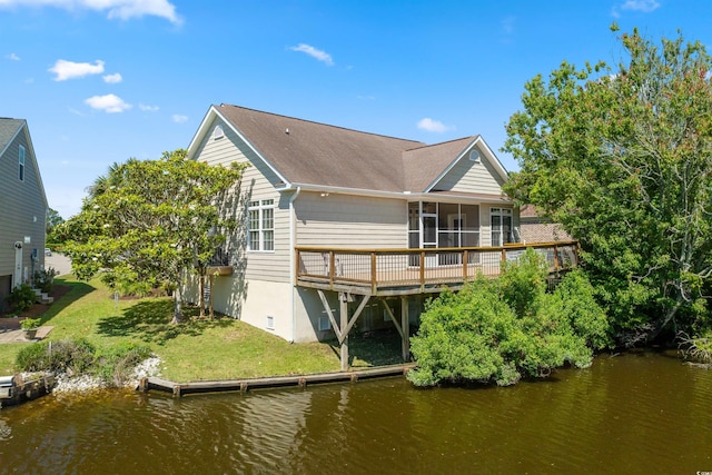 2213 Gazebo Ct, North Myrtle Beach, SC 29582 - back of house with a sunroom, a deck with water view, a yard, and a shingled roof