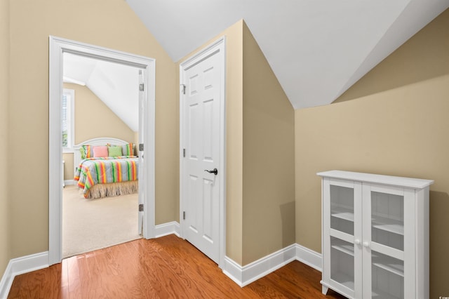 2213 Gazebo Ct, North Myrtle Beach, SC 29582 - corridor featuring vaulted ceiling, wood finished floors, and baseboards
