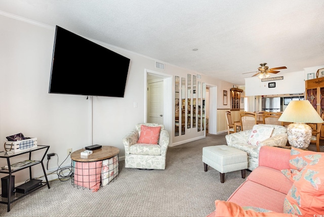 1310 N Waccamaw Dr Unit 211, Garden City Beach, SC 29576 - living area with carpet flooring, ceiling fan, and ornamental molding