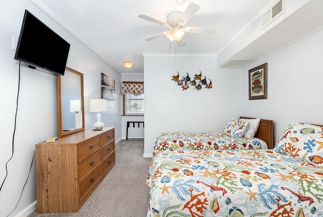 bedroom with carpet flooring, ornamental molding, baseboards, and ceiling fan