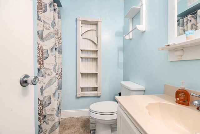1310 N Waccamaw Dr Unit 211, Garden City Beach, SC 29576 - bathroom with toilet, vanity, tile patterned floors, a shower with shower curtain, and baseboards