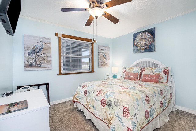1310 N Waccamaw Dr Unit 211, Garden City Beach, SC 29576 - bedroom with carpet floors, baseboards, a ceiling fan, and crown molding