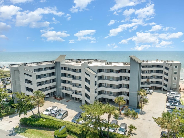 view of apartment building / complex with a water view