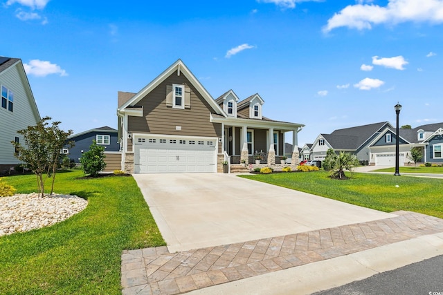 craftsman-style home featuring concrete driveway, stone siding, covered porch, a front yard, and a garage