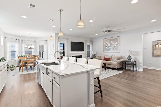 kitchen with recessed lighting, visible vents, and wood finished floors