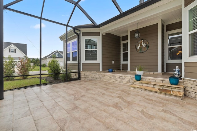 view of patio with covered porch and a lanai