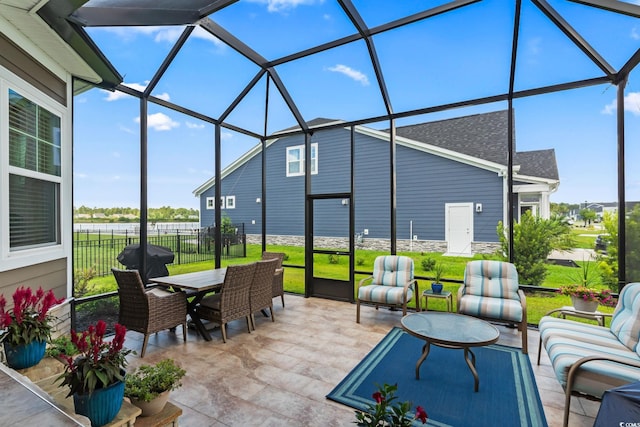 sunroom / solarium with an outdoor living space and outdoor dining area