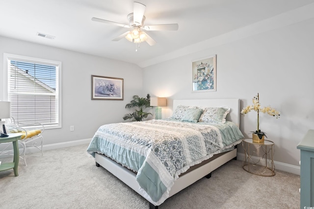 bedroom featuring baseboards, visible vents, ceiling fan, and carpet