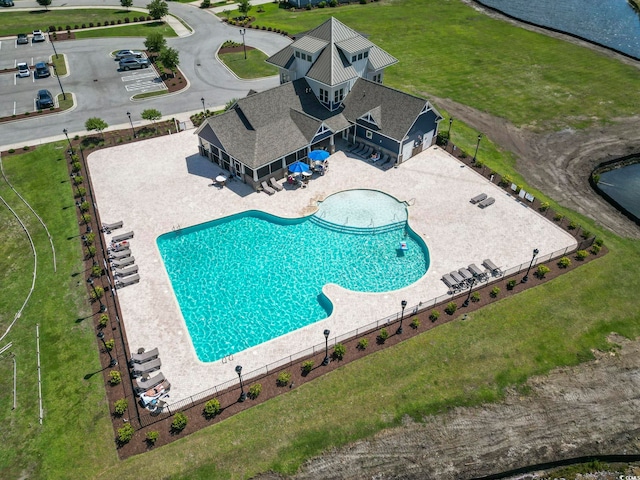 pool featuring a patio area and fence