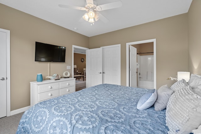 bedroom with a ceiling fan, baseboards, ensuite bathroom, and carpet