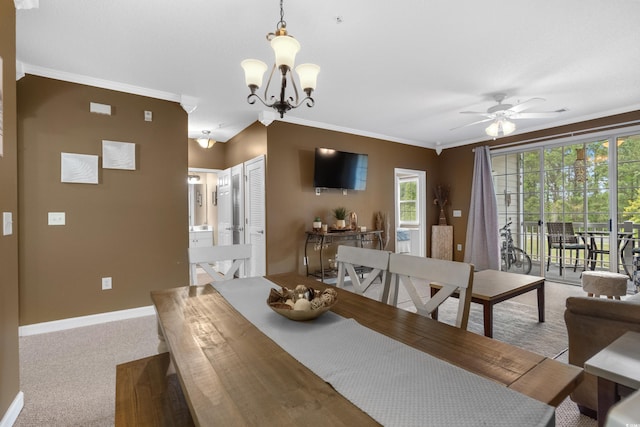 dining area featuring carpet floors, baseboards, ornamental molding, and ceiling fan with notable chandelier