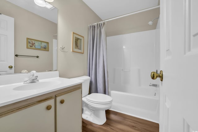 full bathroom featuring vanity, shower / tub combo with curtain, wood finished floors, and toilet