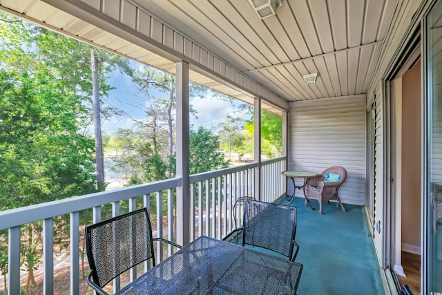 balcony featuring outdoor dining area