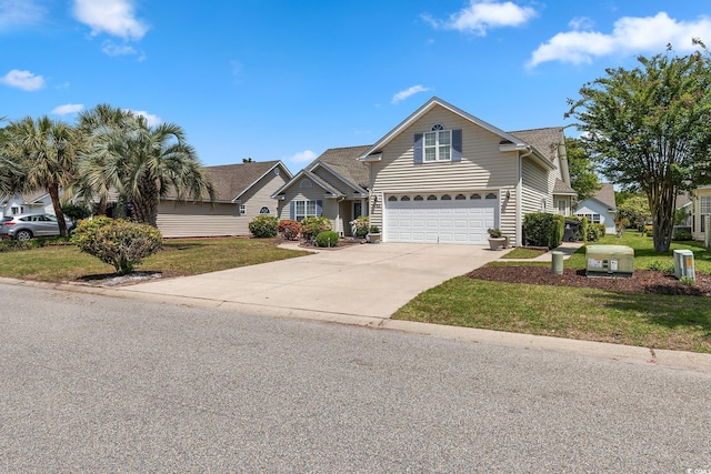 1752 Starbridge Dr, Surfside Beach, SC 29575 - view of front of house with a front lawn, a garage, and concrete driveway