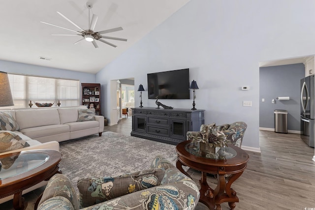 1752 Starbridge Dr, Surfside Beach, SC 29575 - living room with wood finished floors, high vaulted ceiling, a ceiling fan, and visible vents