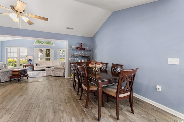 1752 Starbridge Dr, Surfside Beach, SC 29575 - dining room featuring visible vents, ceiling fan, wood finished floors, and vaulted ceiling
