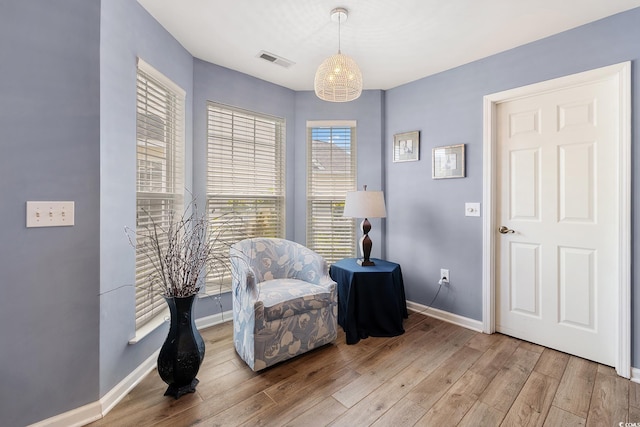 1752 Starbridge Dr, Surfside Beach, SC 29575 - sitting room with visible vents, baseboards, and wood finished floors