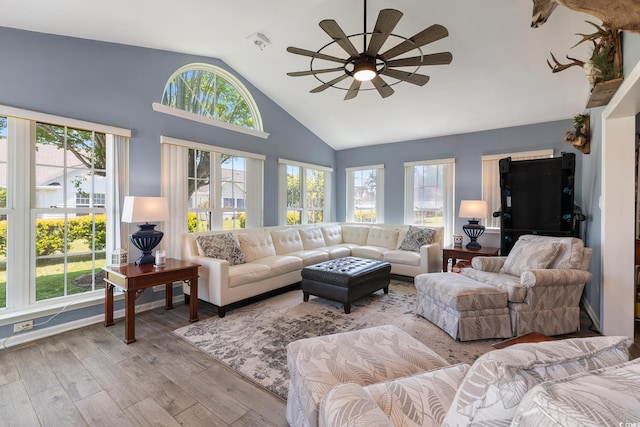 1752 Starbridge Dr, Surfside Beach, SC 29575 - living area with wood finished floors, ceiling fan, and high vaulted ceiling