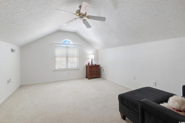 1752 Starbridge Dr, Surfside Beach, SC 29575 - living area featuring vaulted ceiling, a textured ceiling, a ceiling fan, carpet floors, and visible vents