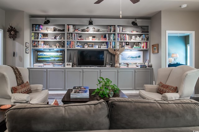 living area with ceiling fan