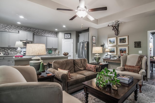 living room featuring recessed lighting, a ceiling fan, and wood finished floors