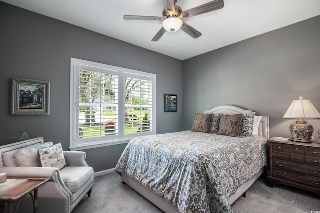 bedroom featuring baseboards, ceiling fan, and carpet flooring