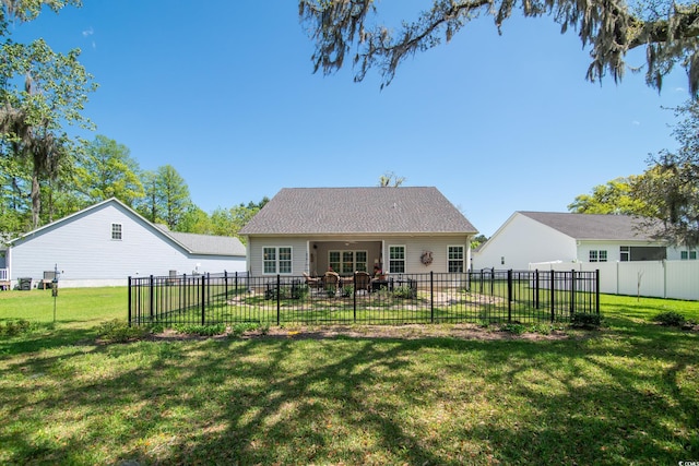 back of house featuring a lawn, a patio, and a fenced backyard