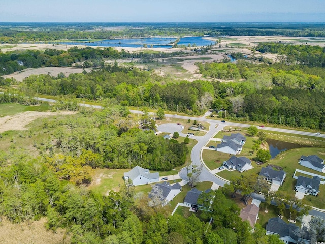 bird's eye view featuring a water view and a residential view