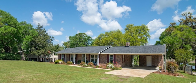 391 Waterford Dr, Georgetown, SC 29440 - single story home featuring a front lawn, driveway, and a carport
