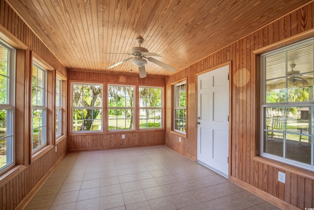 391 Waterford Dr, Georgetown, SC 29440 - unfurnished sunroom featuring tile patterned flooring, baseboards, wood walls, and wooden ceiling