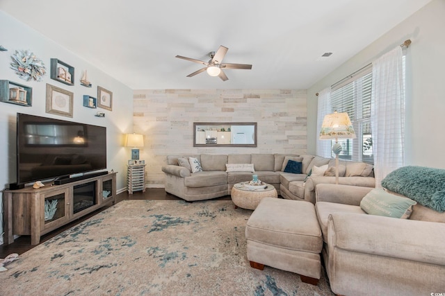 181 Ocean Commons Dr, Surfside Beach, SC 29575 - living area with ceiling fan, an accent wall, wood finished floors, and baseboards