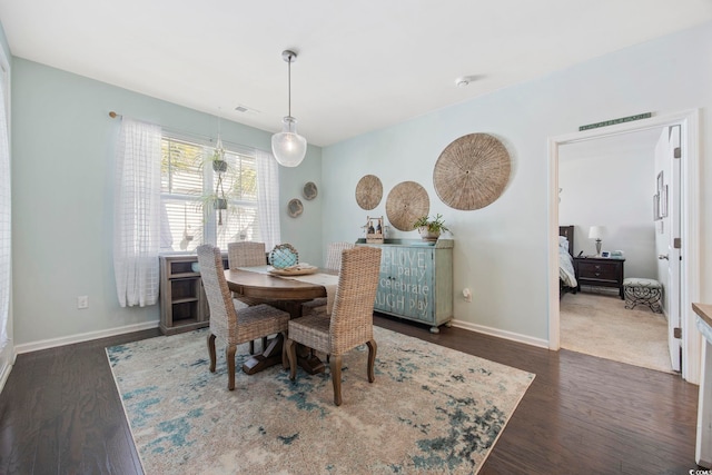 181 Ocean Commons Dr, Surfside Beach, SC 29575 - dining room with visible vents, baseboards, and wood finished floors