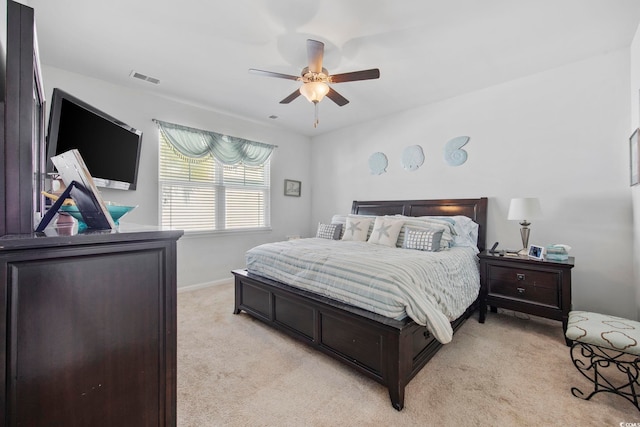 181 Ocean Commons Dr, Surfside Beach, SC 29575 - bedroom with visible vents, baseboards, ceiling fan, and light carpet