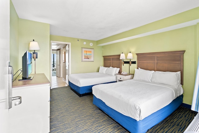 3000 N Ocean Blvd Unit 729, Myrtle Beach, SC 29577 - bedroom featuring carpet floors, baseboards, and tile patterned flooring