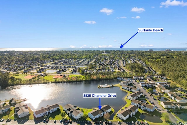 birds eye view of property featuring a residential view and a water view