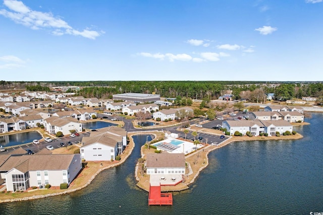 bird's eye view with a residential view and a water view