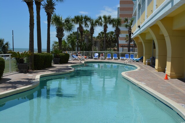 2000 Ocean Blvd N Unit 216, Myrtle Beach, SC 29588 - community pool with fence and a patio area