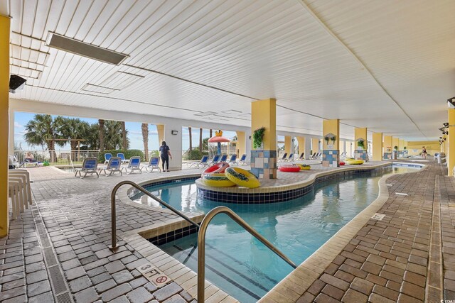 2000 Ocean Blvd N Unit 216, Myrtle Beach, SC 29588 - indoor community pool featuring a patio area and fence