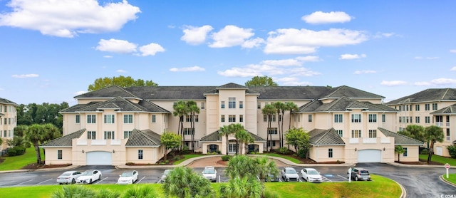 2180 Waterview Dr Unit 632, North Myrtle Beach, SC 29582 - view of building exterior featuring a garage, a residential view, and driveway